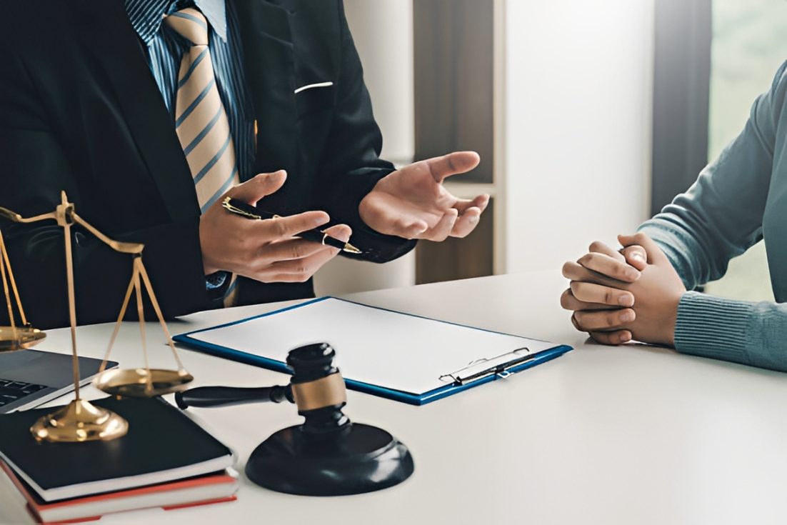 Meeting in lawyer's office with paperwork